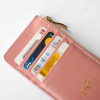 Portefeuille zippé rose